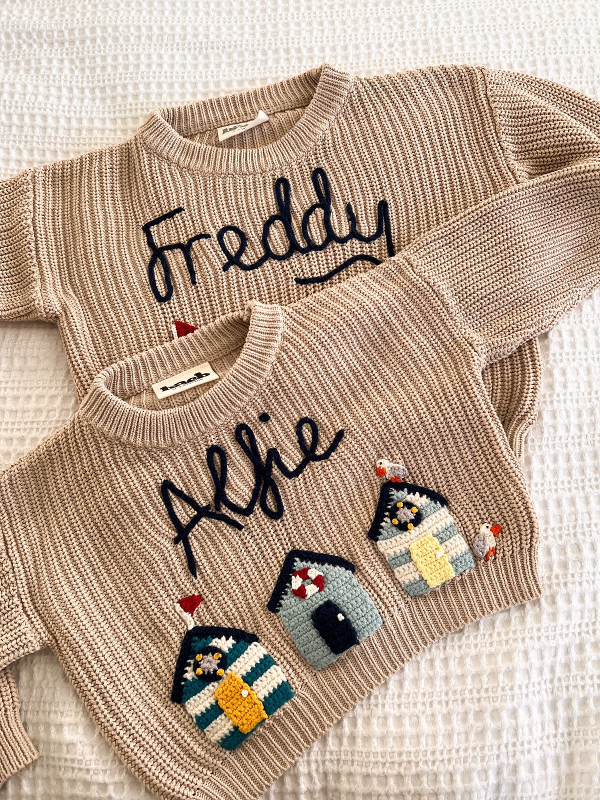 Two jumpers with the names Freddy and Alfie