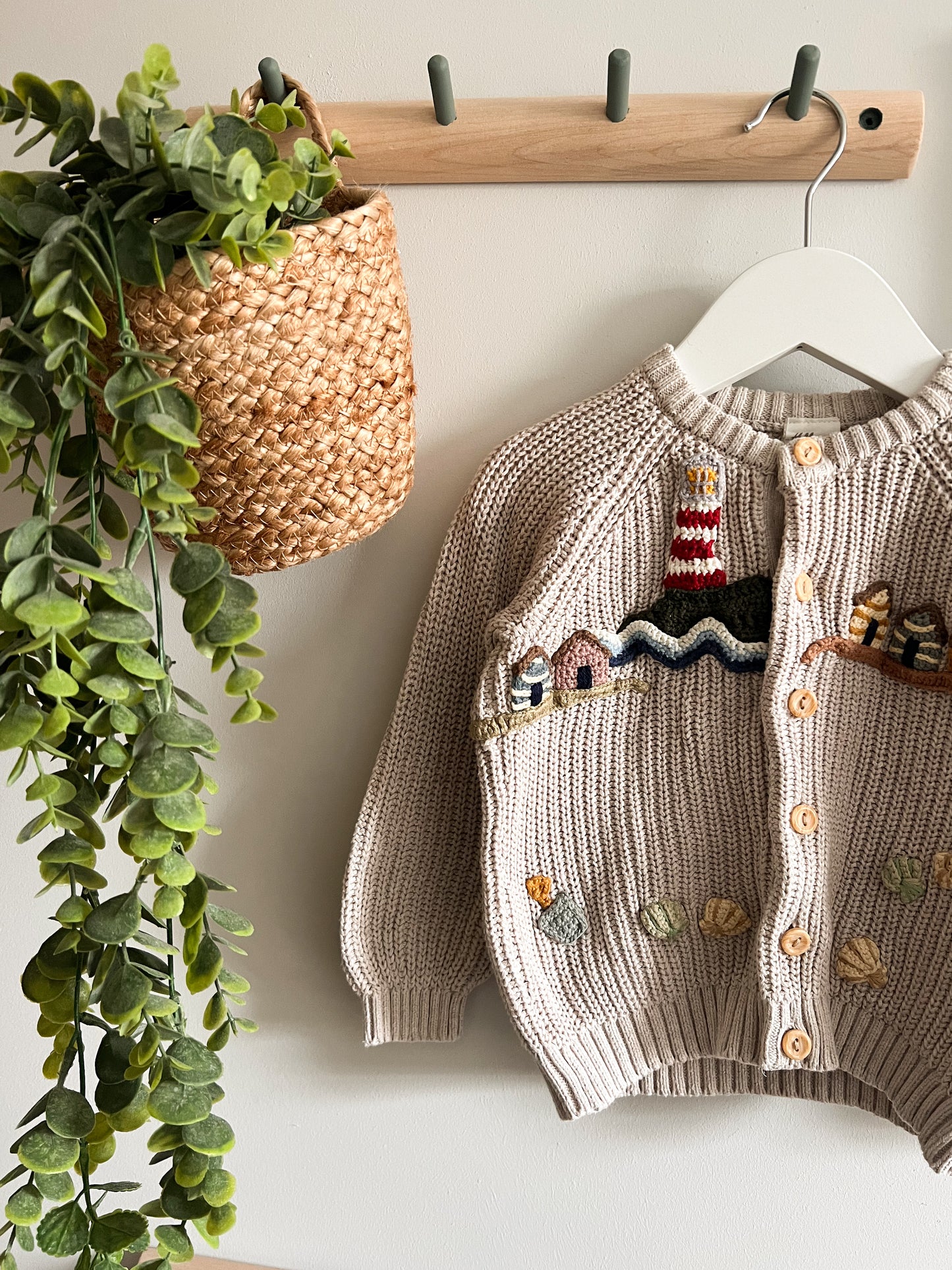 Beige cardigan with a lighthouse design